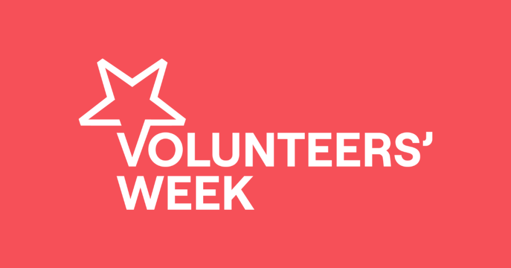 The white logo for Volunteers' Week on a red background