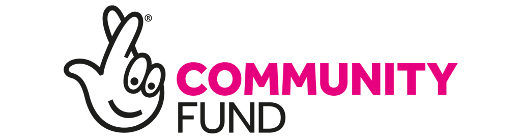 The Community Fund logo featuring a smiley face on a hand with the fingers crossed.