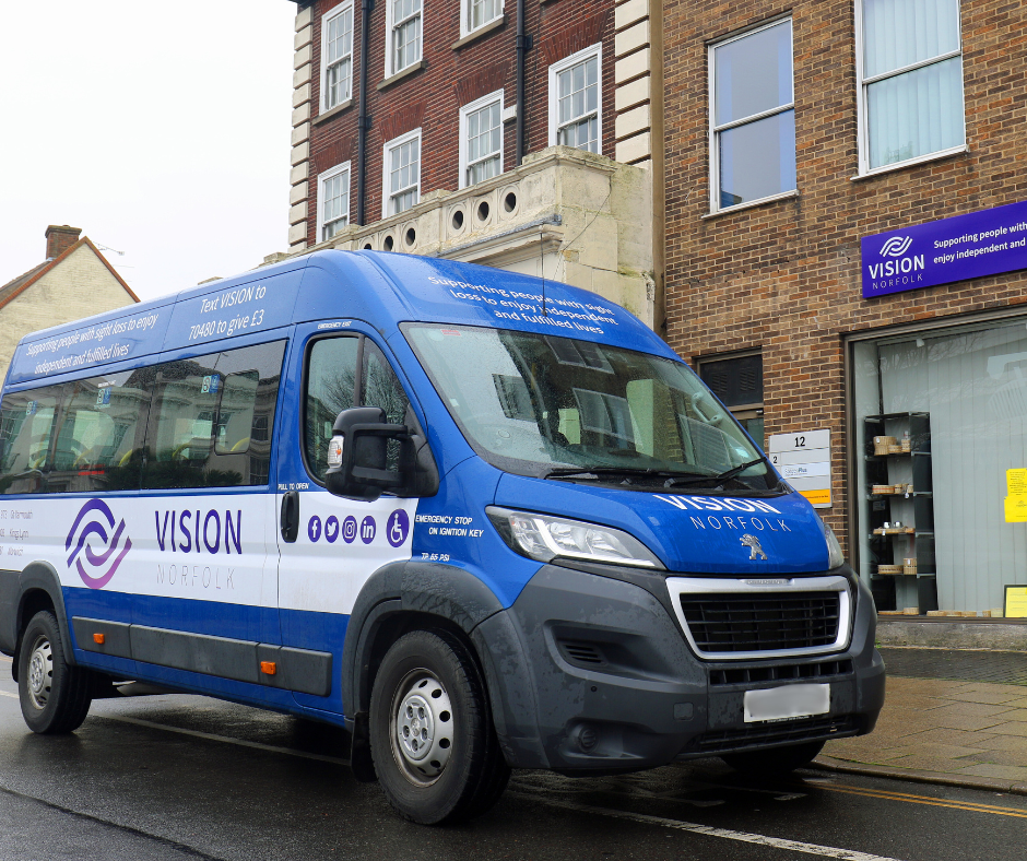 A blue and white Vision Norfolk van parked outside the Great Yarmouth hub